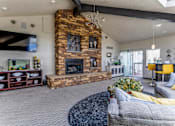 Thumbnail 19 of 37 - Clubhouse with fireplace and tv  at Union Heights Apartments, Colorado Springs, CO