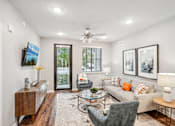 Thumbnail 14 of 86 - a living room with a couch and chairs and a ceiling fan at Edge75, Naples, Florida 34104