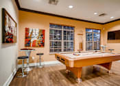 Thumbnail 23 of 45 - a game room with a pool table and a tv at Heritage at Stone Mountain, Northglenn, CO, 80233