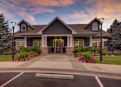 Thumbnail 13 of 45 - the front of a house with a driveway and a sunset at Heritage at Stone Mountain, Northglenn, CO, 80233