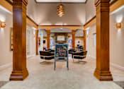 Thumbnail 15 of 45 - Lobby with a chalkboard sign in the middle at Heritage at Stone Mountain, Northglenn, CO, 80233