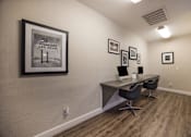 Thumbnail 13 of 22 - Computer center with a computer desk and a picture on the wall at 2900 Lux Apartment Homes, Nevada