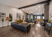 Thumbnail 10 of 22 - Clubhouse with couches and chairs and a table at 2900 Lux Apartment Homes, Nevada
