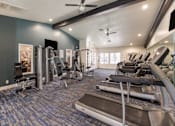 Thumbnail 15 of 22 - Gym with treadmills and other cardio equipment at 2900 Lux Apartment Homes, Nevada