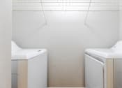 Thumbnail 34 of 117 - a washer and dryer in a laundry room at Heritage Bay, Jensen Beach Florida