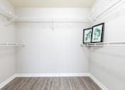 Thumbnail 25 of 117 - an empty closet with white walls and white shelves at Heritage Bay, Jensen Beach, 34957