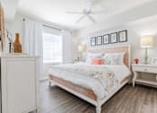 Thumbnail 16 of 117 - a bedroom with a bed and two nightstands at Heritage Bay, Florida