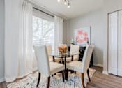Thumbnail 14 of 117 - a dining room with a table and chairs at Heritage Bay, Jensen Beach Florida