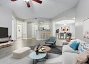 Thumbnail 1 of 50 - Living room with a couch and a table
