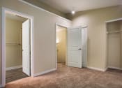 Thumbnail 14 of 31 - A bedroom with two doors at Arcadia Townhomes, Federal Way, WA