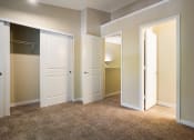 Thumbnail 16 of 31 - Bedroom with closet and two doors at Arcadia Townhomes, Federal Way, WA