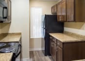 Thumbnail 6 of 31 - A kitchen at at Arcadia Townhomes, Federal Way, WA