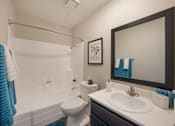 Thumbnail 8 of 22 - Bathroom with sink toilet and tub at 2900 Lux Apartment Homes, Nevada