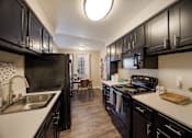 Thumbnail 3 of 22 - Kitchen and dining room at 2900 Lux Apartment Homes, Nevada