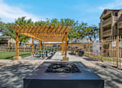 Thumbnail 12 of 23 - Outdoor firepit and pergola at Mountain Run Apartments, New Mexico, 87111