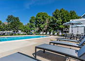 Thumbnail 32 of 44 - Invigorating Swimming Pool at Windmill Apartments, Colorado Springs
