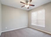 Thumbnail 4 of 17 - Bedroom with Ceiling Fan at Bridford Lake Apartments, Greensboro, NC