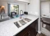 Thumbnail 3 of 26 - Kitchen with Granite Counters at Canopy Glen, Norcross, GA