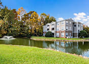 Thumbnail 13 of 32 - Lake With Lush Natural Surrounding at Cedar Springs Apartments, Raleigh, 27609