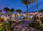 Thumbnail 85 of 86 - View of Tropical Courtyard at Night at Edge75, Naples, FL