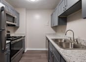 Thumbnail 47 of 92 - Kitchen with stainless steel appliances at Esplanade at City Park, Louisiana