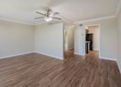 Thumbnail 30 of 92 - Empty living room with ceiling fan at Esplanade at City Park, New Orleans, Louisiana
