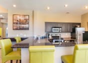 Thumbnail 10 of 17 - Fitted Kitchen With Island Dining at Heritage at Hidden Creek, Colorado, 80918