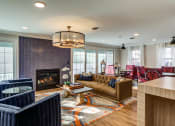 Thumbnail 5 of 37 - Clubroom With Fireplace at Heritage at the River, Manchester, NH