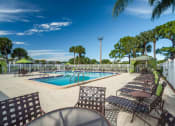Thumbnail 17 of 24 - Poolside Sundeck at Lakeside Glen Apartments, Melbourne, FL, 32904