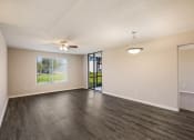 Thumbnail 7 of 24 - Living Room with Wood Style Flooring at Lakeside Glen Apartments, Melbourne, FL, 32904