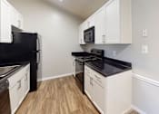 Thumbnail 11 of 23 - White Kitchen Cabinetry at Montclair Apartments, Maryland