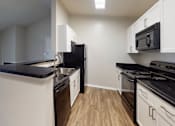 Thumbnail 10 of 23 - Kitchen at Montclair Apartments, Silver Spring