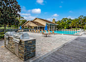 Thumbnail 17 of 22 - Poolside Grills at Sanford Landing Apartments, 32771