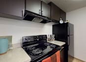 Thumbnail 3 of 41 - Kitchen table top with cabinets at North Creek Apartments, Washington