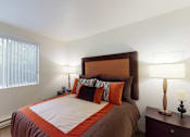 Thumbnail 8 of 41 - Bedroom with cozy bed and window at North Creek Apartments, Everett, WA