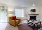 Thumbnail 1 of 41 - Living room with TV at North Creek Apartments, Everett