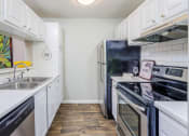 Thumbnail 6 of 23 - Fully Equipped Kitchen at The Pointe at Irving Park, Greensboro, NC, 27408