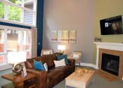 Thumbnail 13 of 23 - Living Area With Fireplace at The Pointe at Irving Park, Greensboro, NC