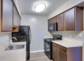Thumbnail 13 of 24 - Kitchen at River Crossing Apartments, Georgia