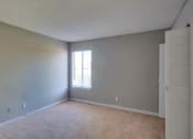Thumbnail 14 of 24 - Spacious Bedroom with Carpeting at River Crossing Apartments, Thunderbolt