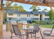 Thumbnail 8 of 24 - Outdoor BBQ Grill Area at River Crossing Apartments, Thunderbolt, GA