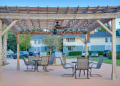 Thumbnail 9 of 24 - BBQ Area with Pergola at River Crossing Apartments, Georgia