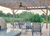 Thumbnail 11 of 24 - BBQ and Picnic Area at River Crossing Apartments, Thunderbolt