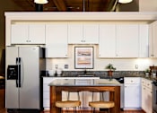 Thumbnail 17 of 42 - White Kitchen Cabinetry at Riverwalk Apartments, Massachusetts