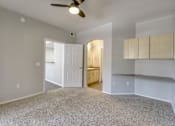 Thumbnail 49 of 105 - Carpeted Living Area at Sweetwater At Metro North Apartments, Phoenix  85029
