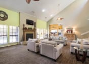 Thumbnail 13 of 16 - Living room with Firepit at The Glen Apartments, Texas, 75067