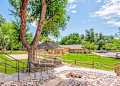Thumbnail 36 of 37 - Landscaped Grounds at Woodland Hills Apartments, Colorado Springs, CO, 80918