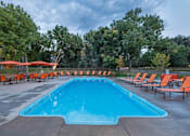 Thumbnail 22 of 37 - Invigorating Swimming Pool at Woodland Hills Apartments, Colorado Springs, Colorado
