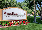 Thumbnail 18 of 37 - Property Signage at Woodland Hills Apartments, Colorado Springs, Colorado
