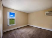 Thumbnail 20 of 33 - an empty room with a window and an air conditioner at Broadmoor Springs, Colorado Springs, CO, 80906